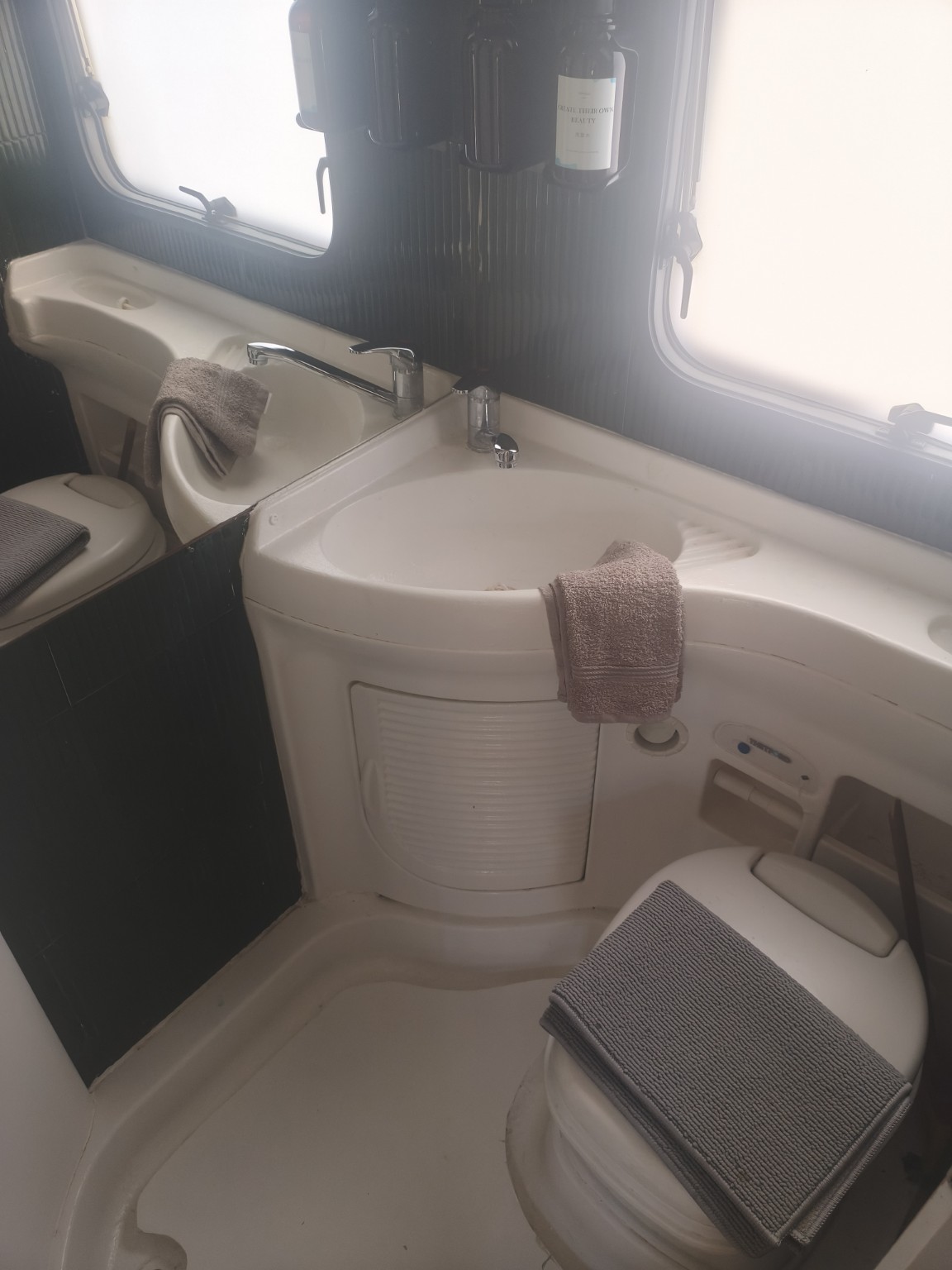Washbasin and toilet inside Concha Caravan