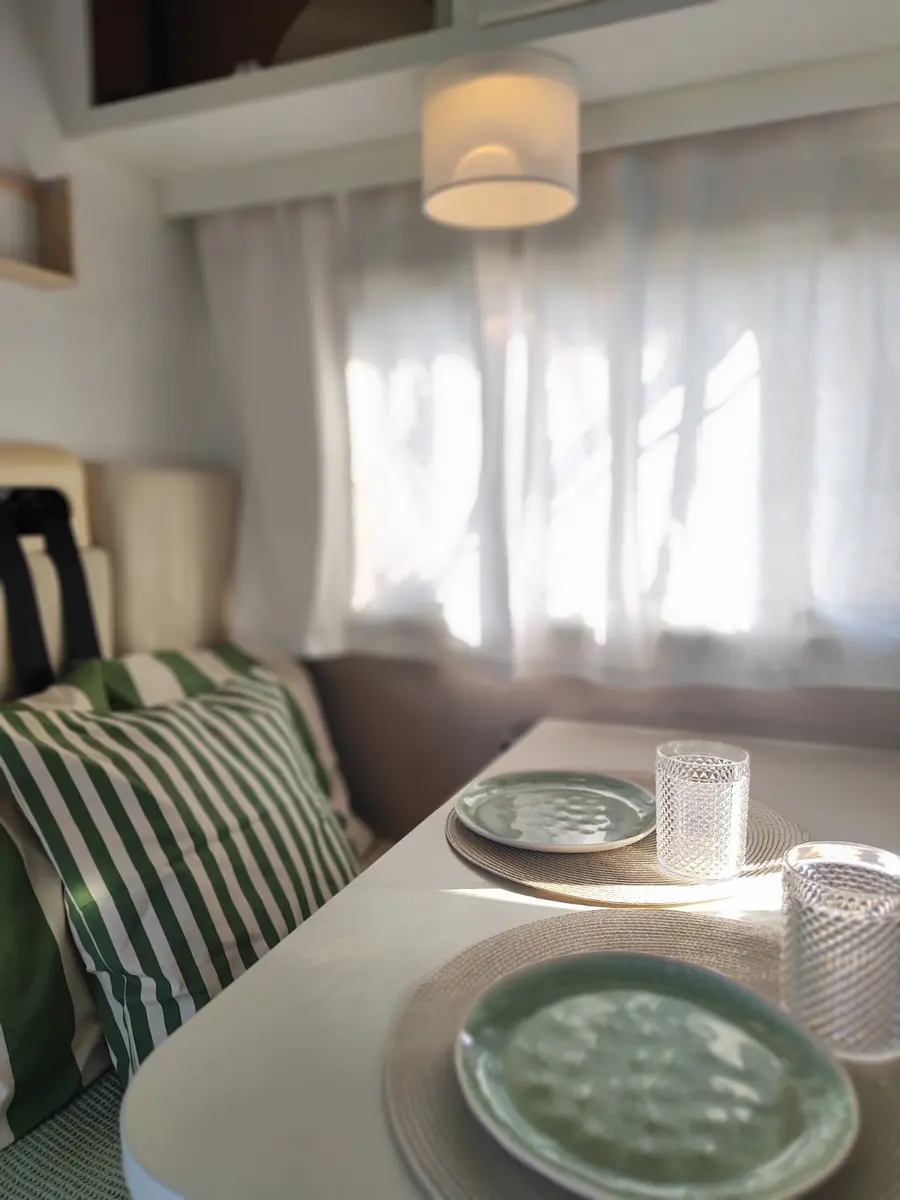 Bright dining area inside Concha Caravan