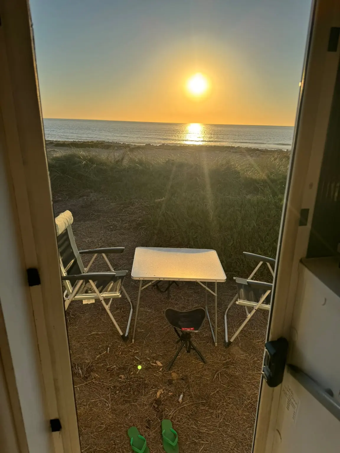 Atlantic sunset seen from the open door of Concha Caravan