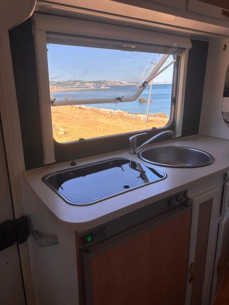 Kitchen with sink, hob and sea view
